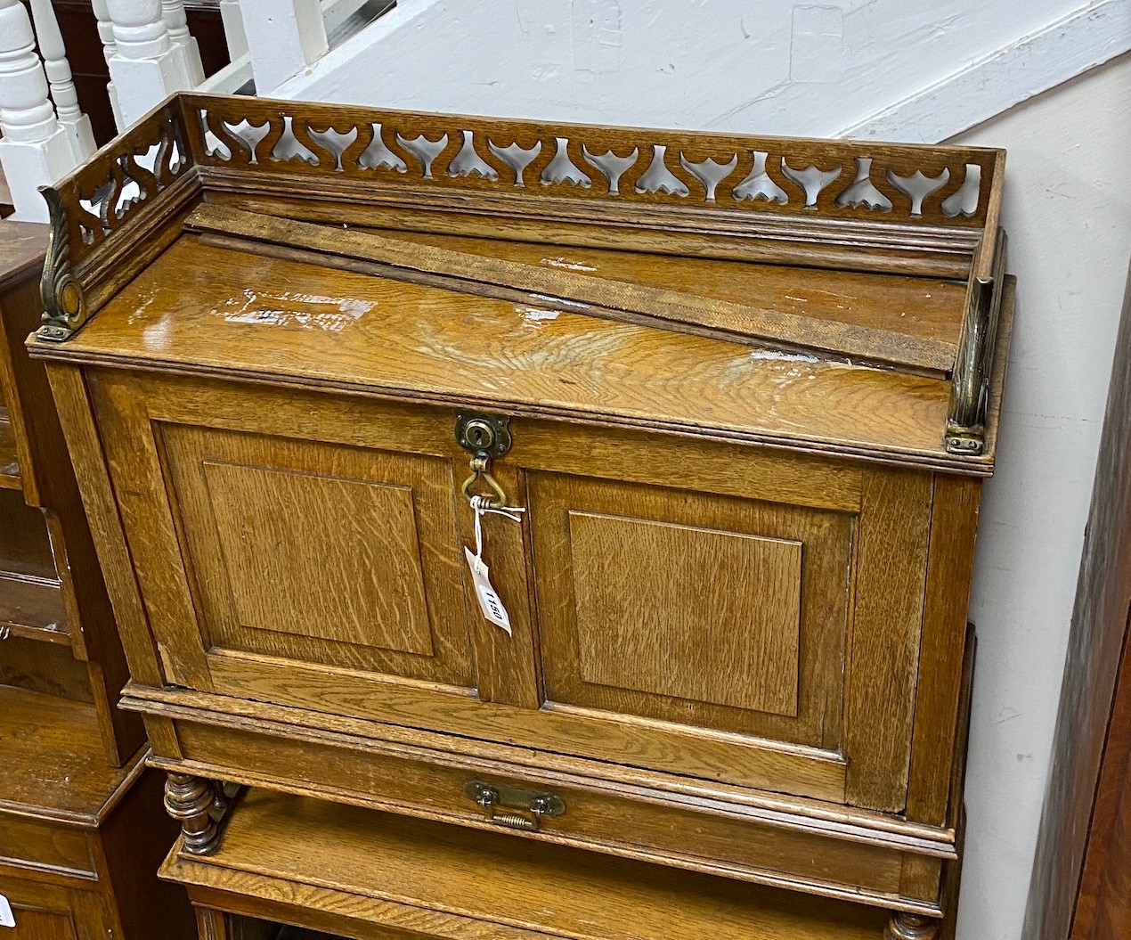 An early 20th century Continental oak writing cabinet, width 70cm, depth 24cm, height 122cm